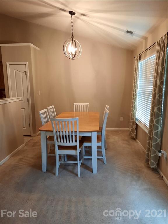 144 Bluffton Road Mooresville, NC 28115 - Photo 8 of 16 a dining room with furniture and window