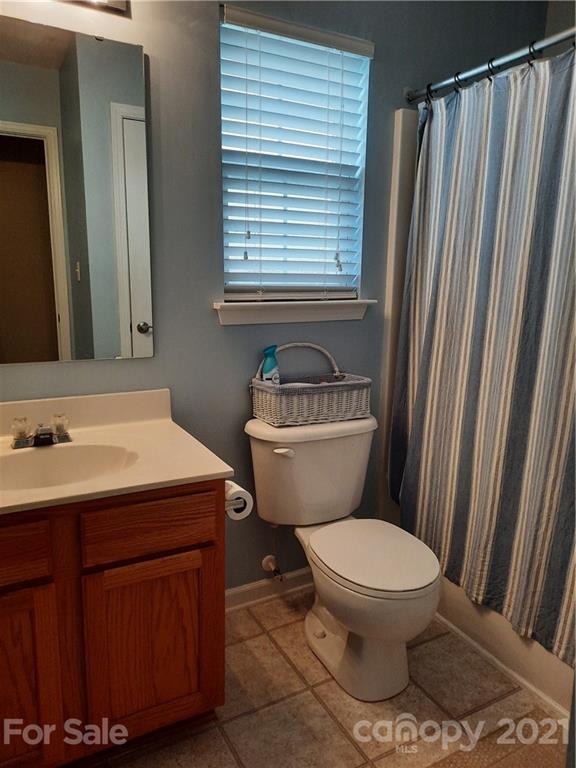 144 Bluffton Road Mooresville, NC 28115 - Photo 9 of 16 a bathroom with a sink toilet and shower