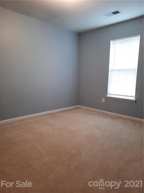 144 Bluffton Road Mooresville, NC 28115 - Photo 10 of 16 an empty room with a window