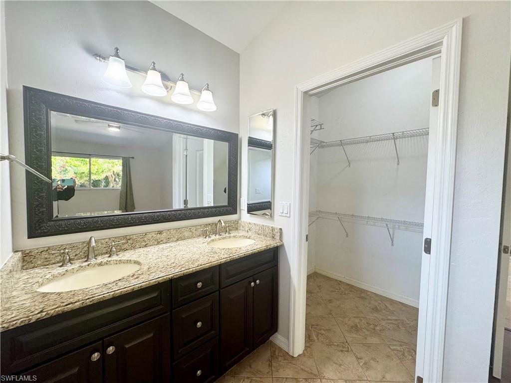 8137 Pelican Road Fort Myers, FL 33967 - Photo 15 of 21 a bathroom with a granite countertop sink mirror and double