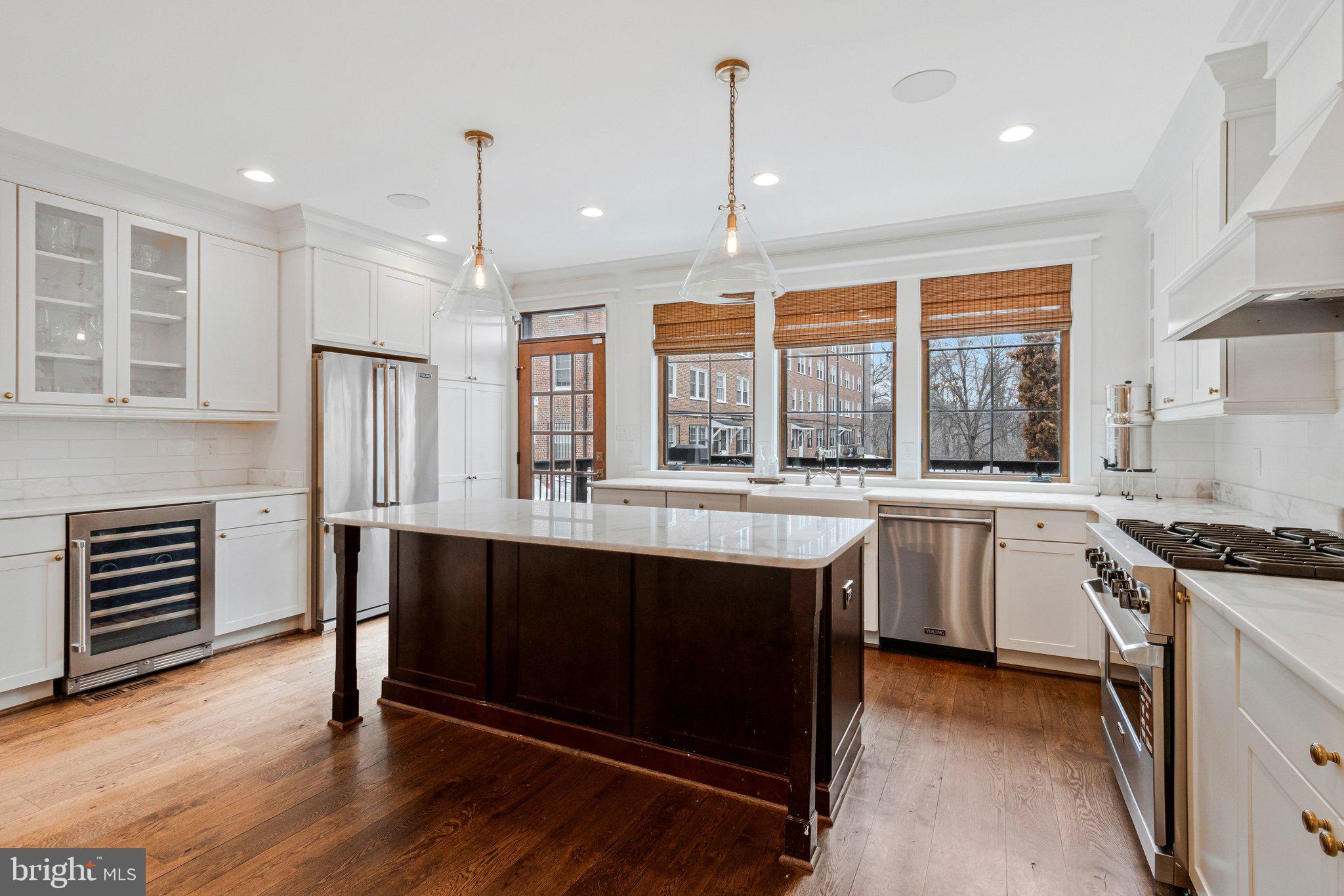 2916 18th Street Northwest Washington, DC 20009 - Photo 11 of 49 a kitchen with stainless steel appliances granite countertop a stove and a sink