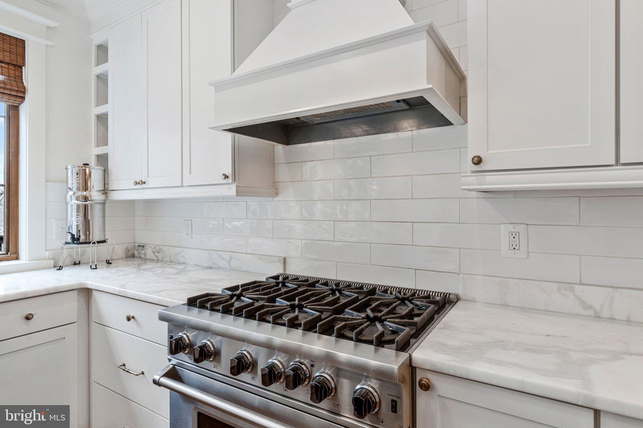 2916 18th Street Northwest Washington, DC 20009 - Photo 12 of 49 a stove top oven sitting inside of a kitchen