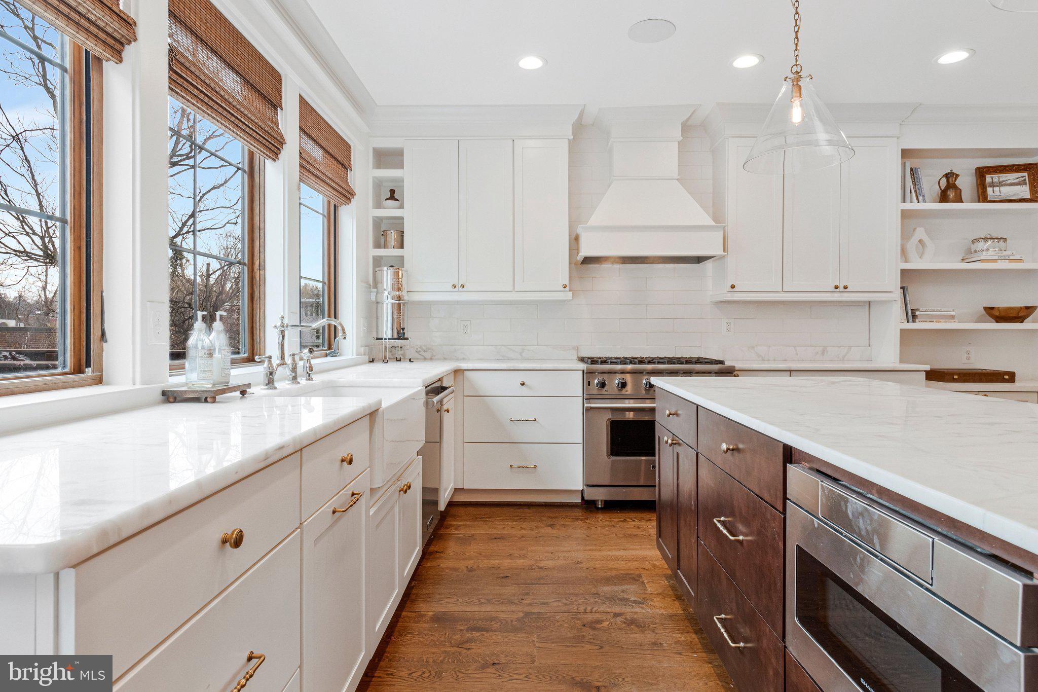 2916 18th Street Northwest Washington, DC 20009 - Photo 13 of 49 a kitchen with a sink window and cabinets