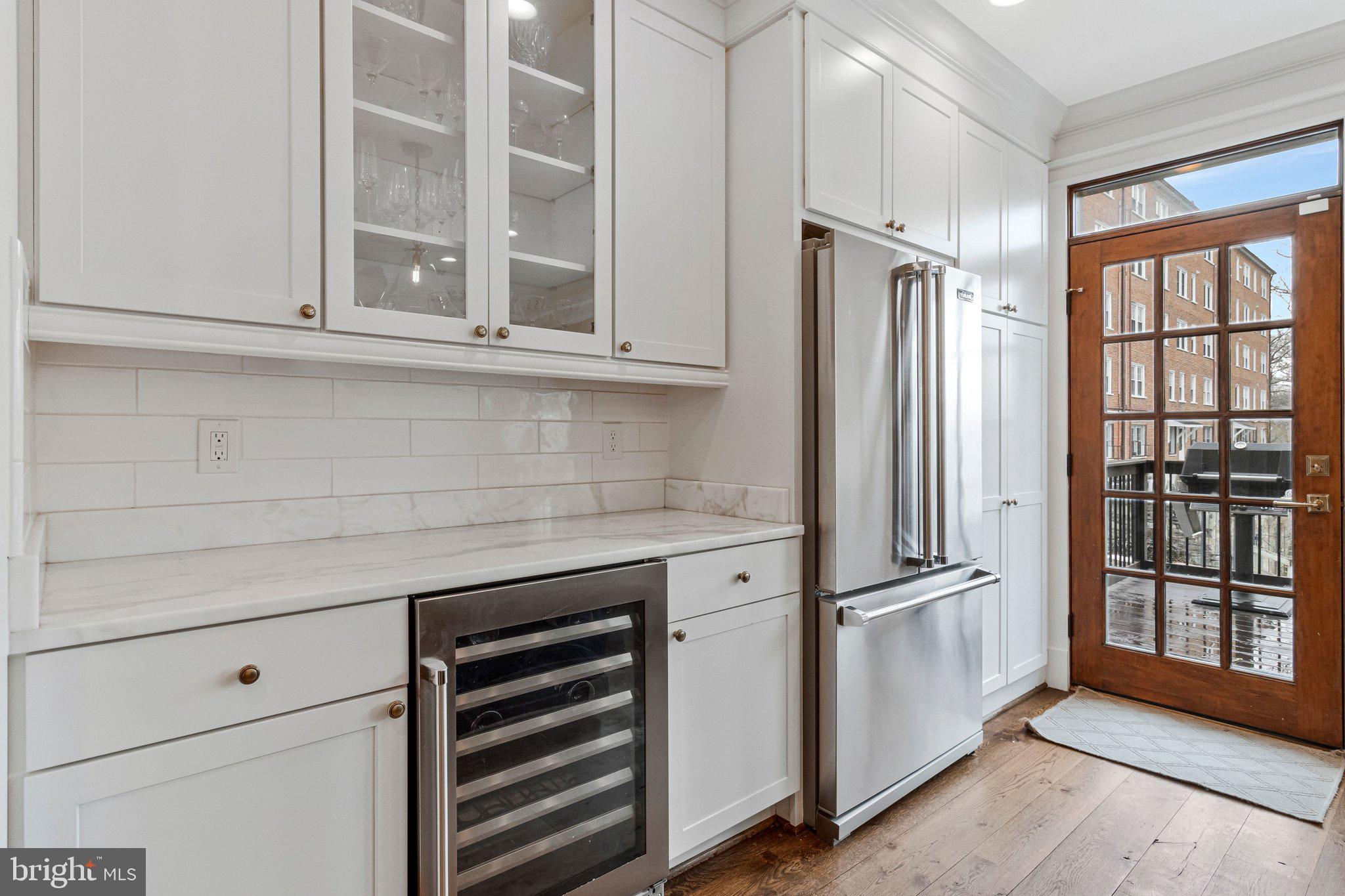 2916 18th Street Northwest Washington, DC 20009 - Photo 15 of 49 a kitchen with a white cabinets and a refrigerator