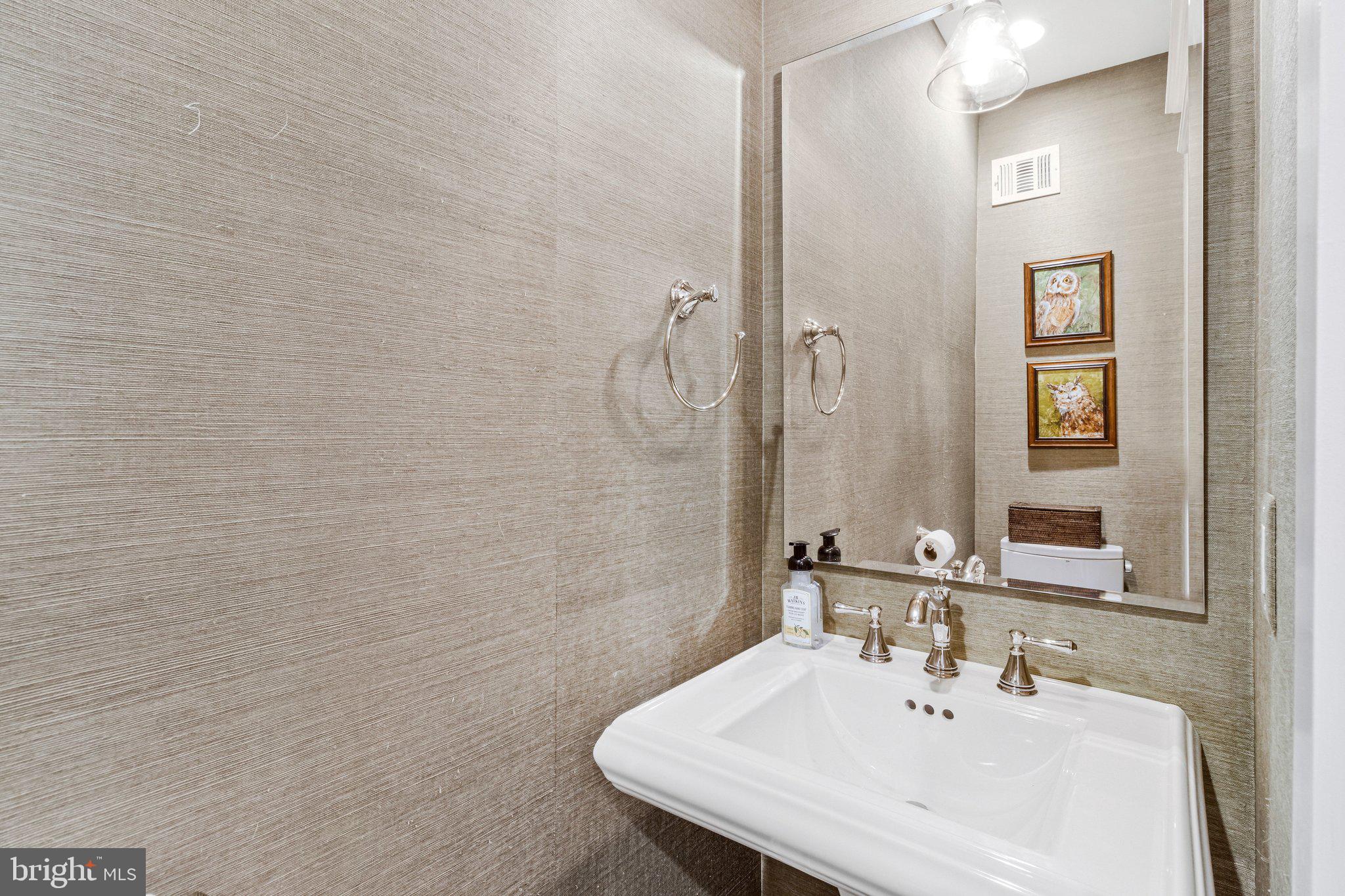 2916 18th Street Northwest Washington, DC 20009 - Photo 16 of 49 a bathroom with a sink and a mirror