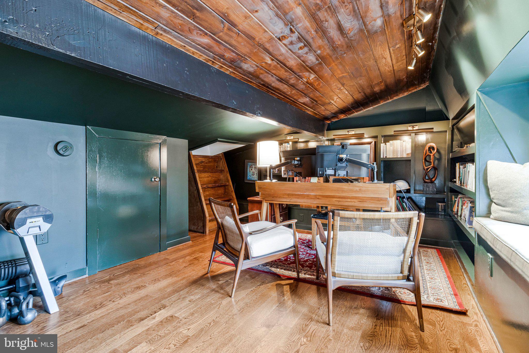 2916 18th Street Northwest Washington, DC 20009 - Photo 17 of 49 a dining room with a wooden table and chairs
