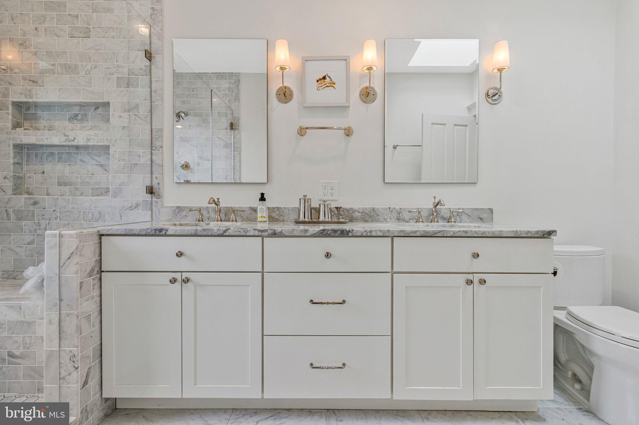 2916 18th Street Northwest Washington, DC 20009 - Photo 22 of 52 a bathroom with a sink and a mirror