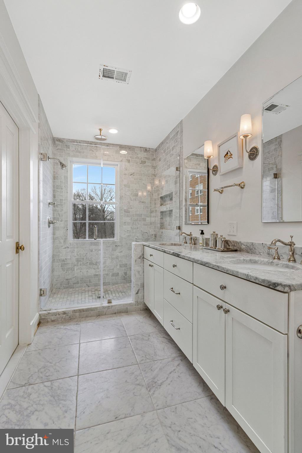 2916 18th Street Northwest Washington, DC 20009 - Photo 23 of 49 a spacious bathroom with a granite countertop sink mirror and shower