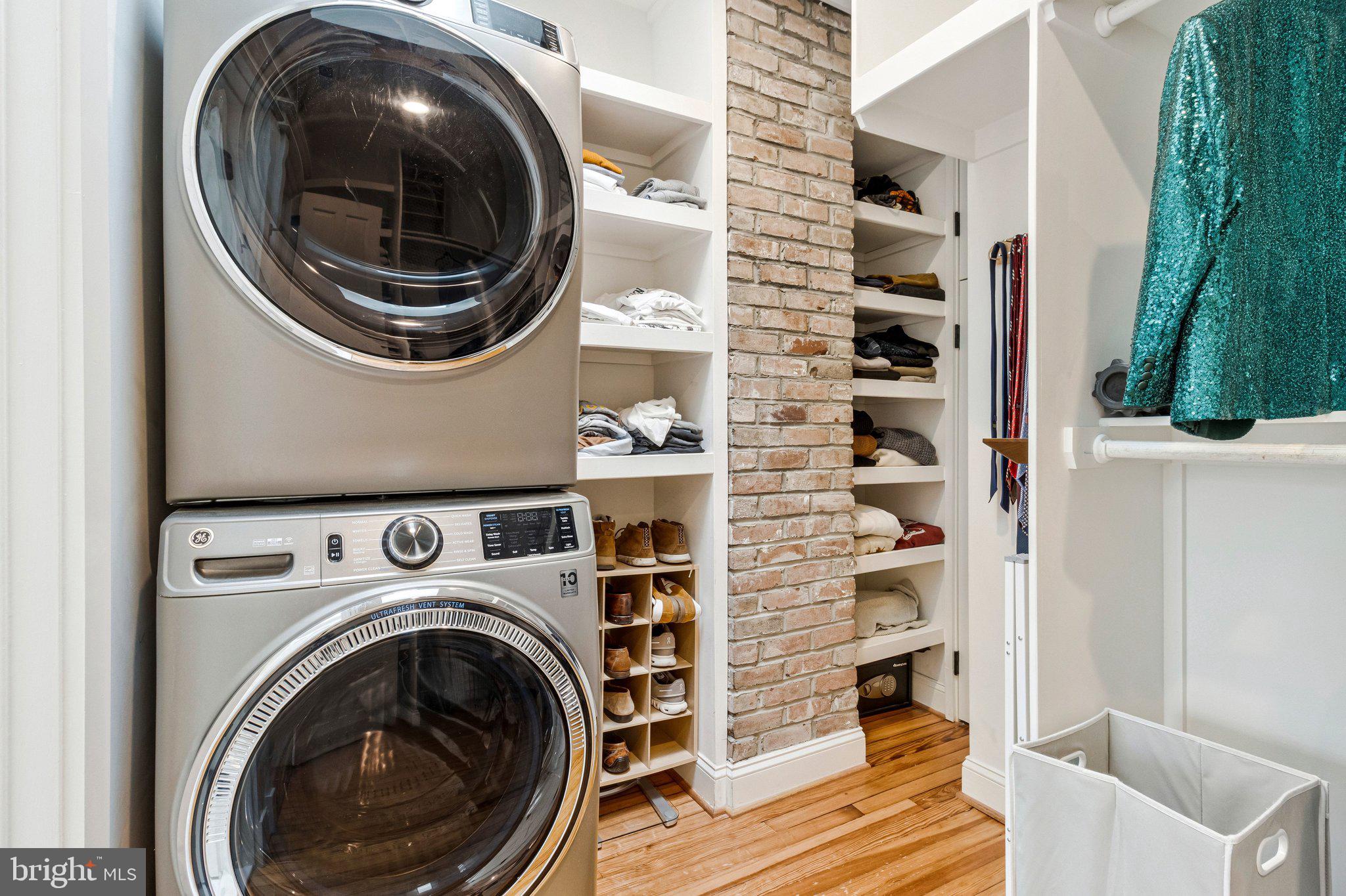 2916 18th Street Northwest Washington, DC 20009 - Photo 25 of 49 a view of a bedroom with washer and dryer