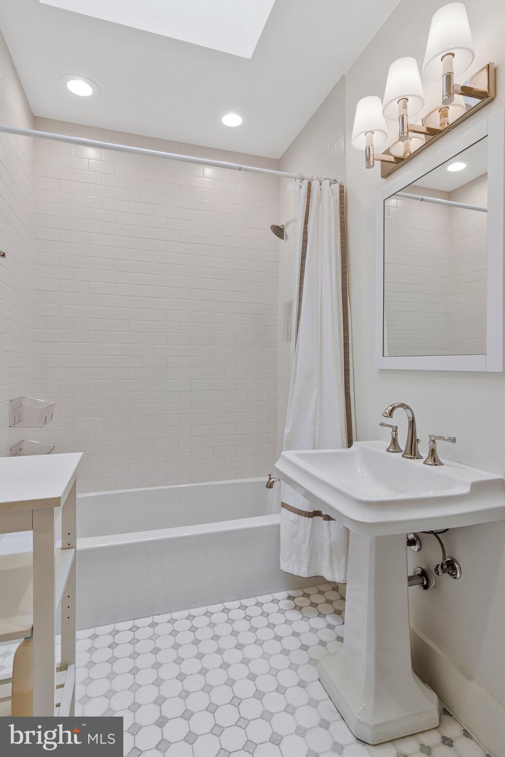 2916 18th Street Northwest Washington, DC 20009 - Photo 27 of 49 a bathroom with a sink a toilet and shower
