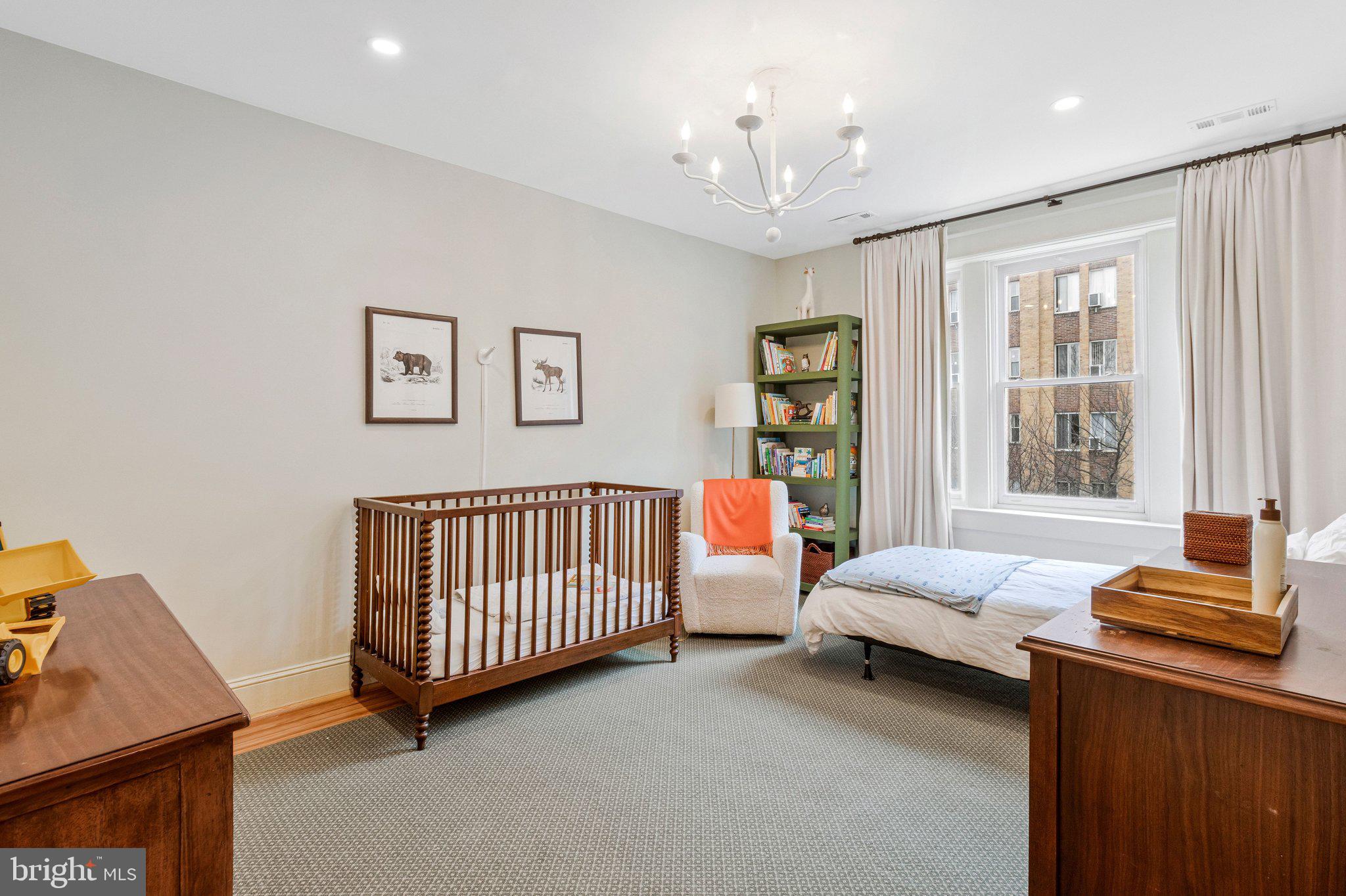 2916 18th Street Northwest Washington, DC 20009 - Photo 31 of 49 a bedroom with a bed and window