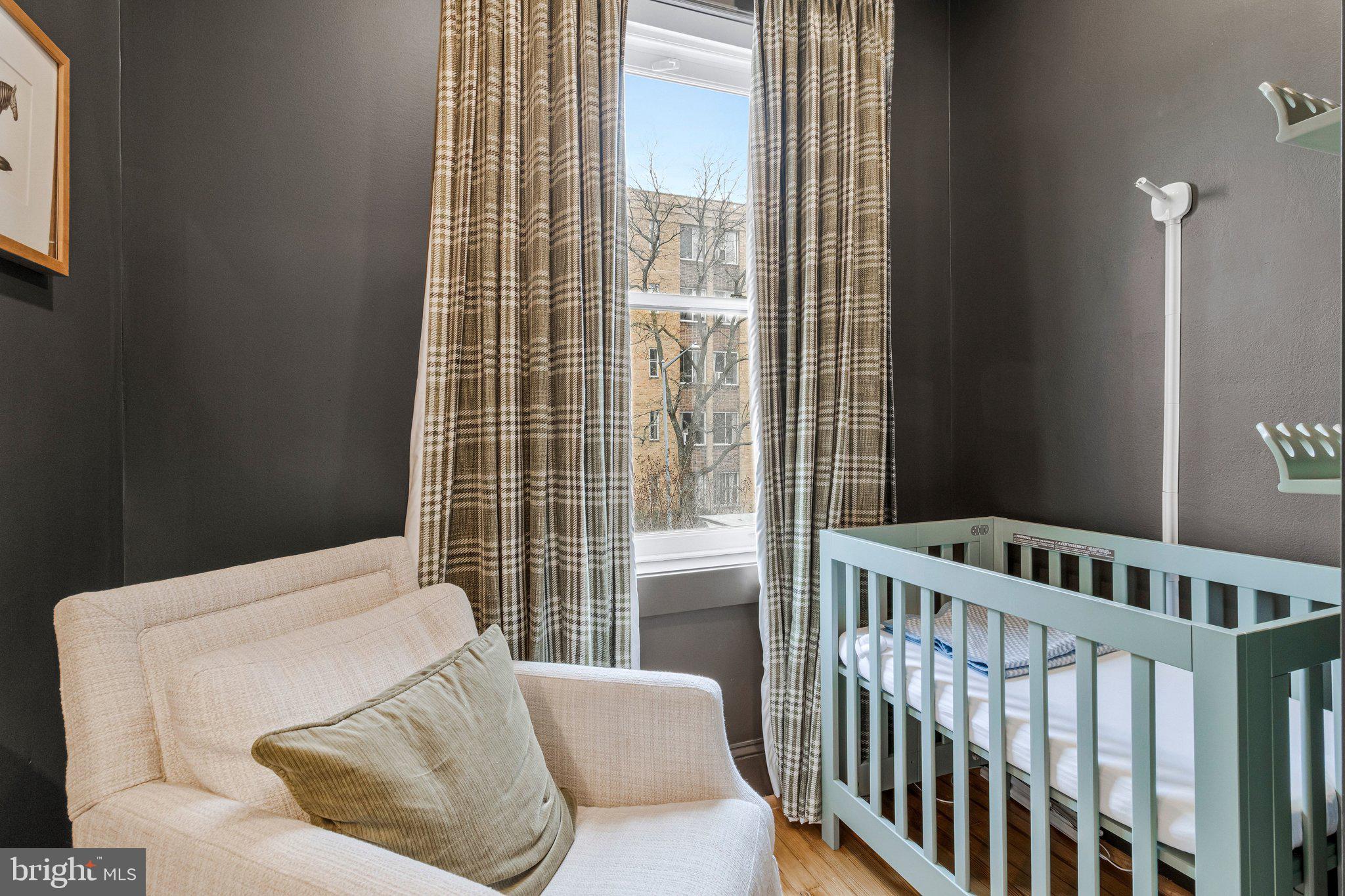 2916 18th Street Northwest Washington, DC 20009 - Photo 33 of 49 a bedroom with furniture and a window