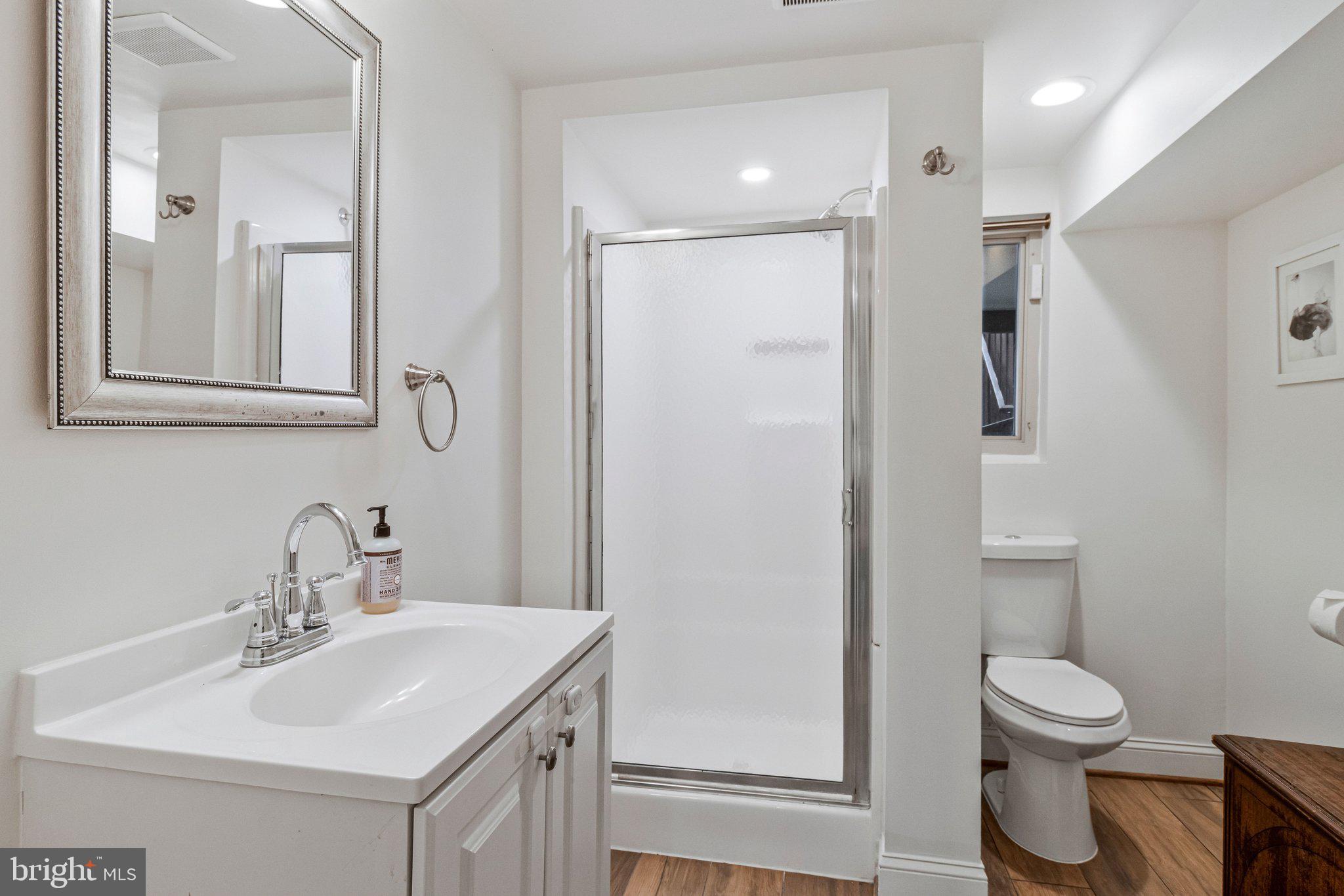 2916 18th Street Northwest Washington, DC 20009 - Photo 36 of 49 a bathroom with a toilet sink and mirror