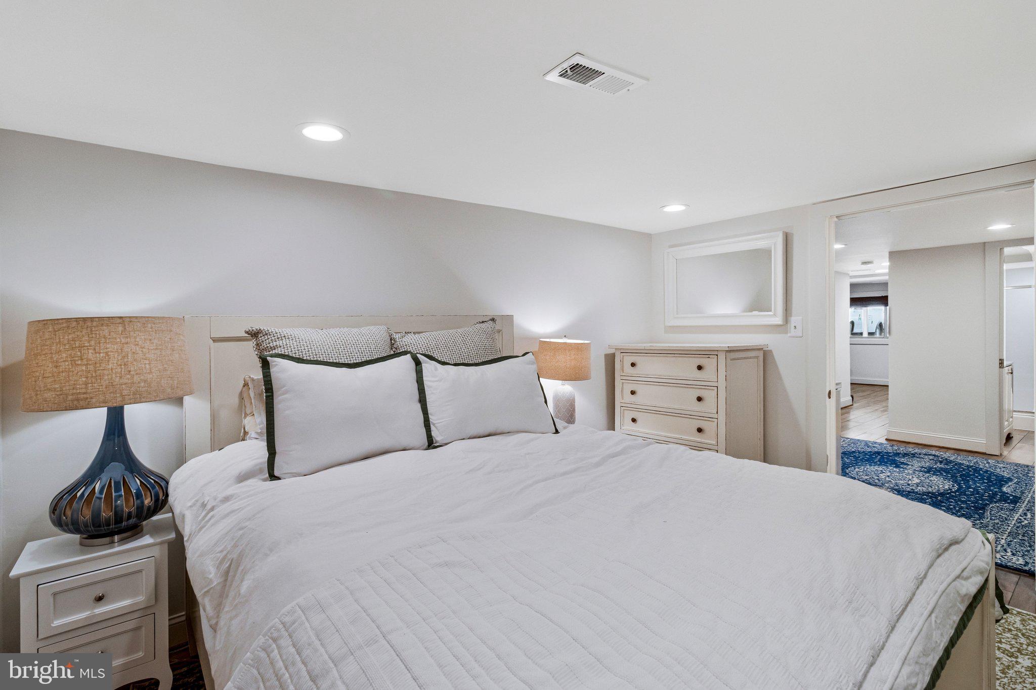 2916 18th Street Northwest Washington, DC 20009 - Photo 37 of 49 a bedroom with a bed and a night stand