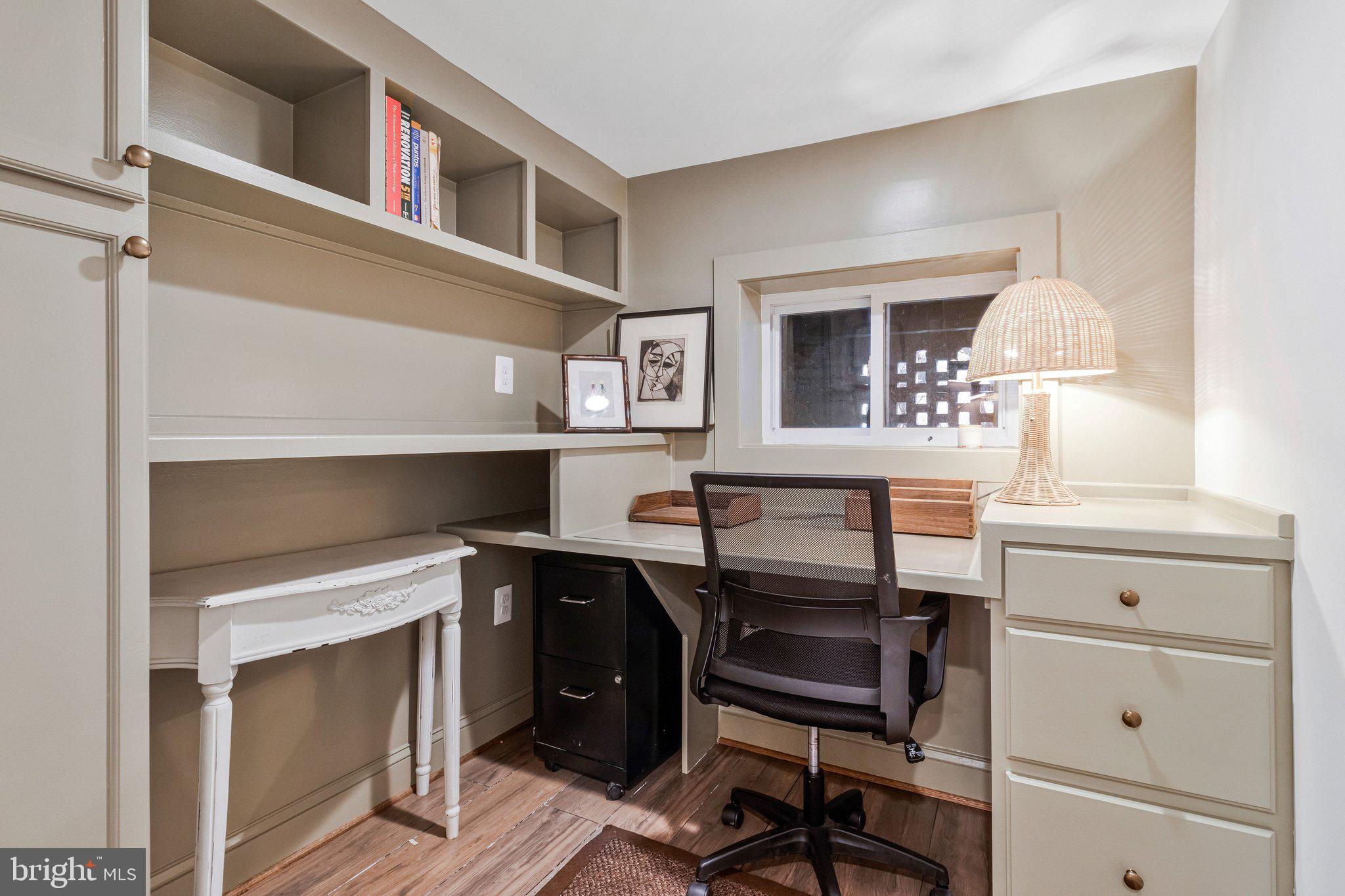 2916 18th Street Northwest Washington, DC 20009 - Photo 39 of 52 a view of a workspace with furniture and a fireplace