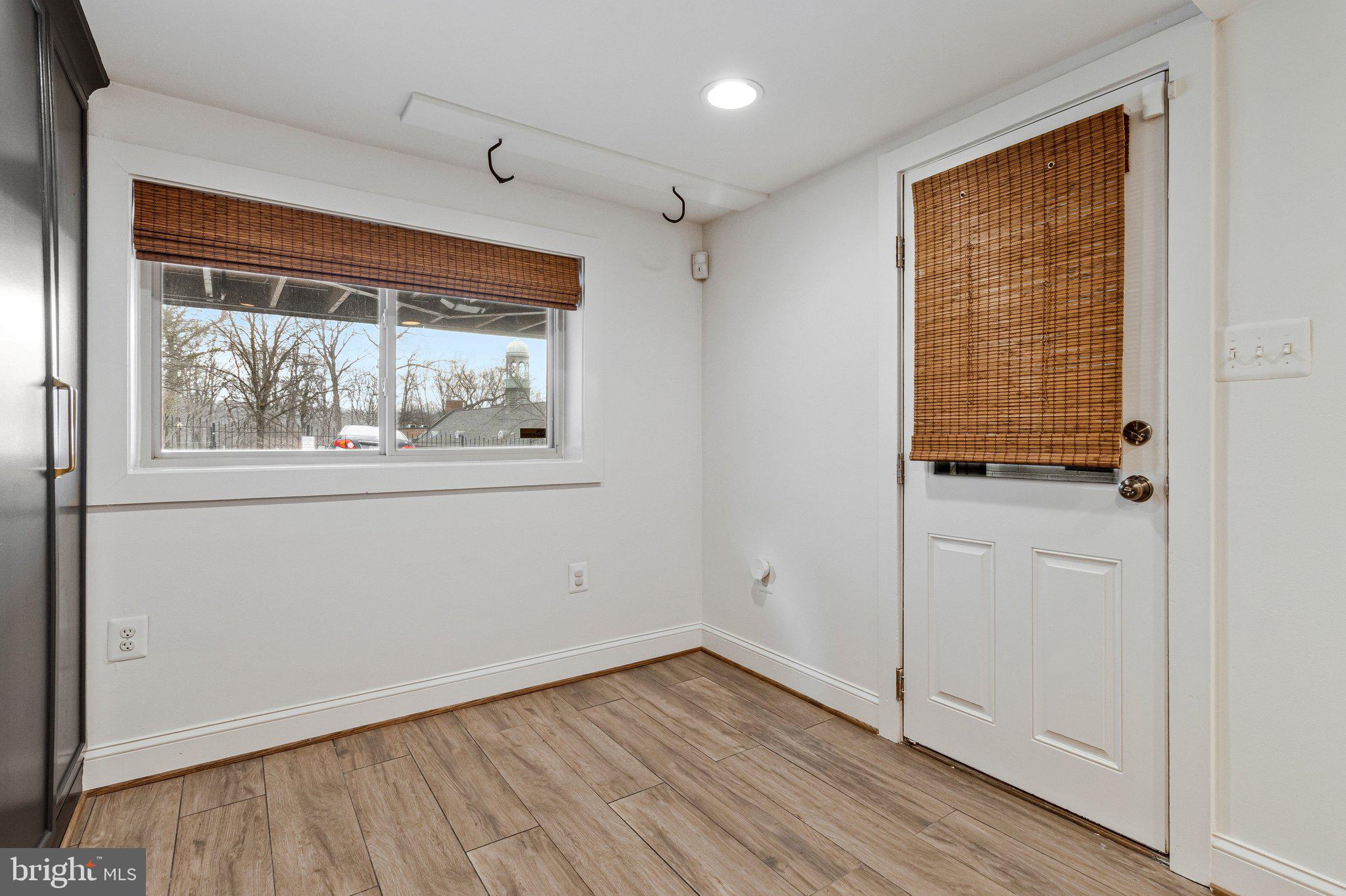 2916 18th Street Northwest Washington, DC 20009 - Photo 43 of 49 a view of an empty room with wooden floor and a window