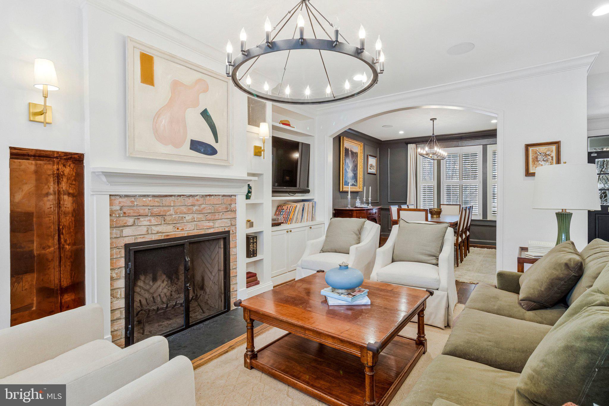 2916 18th Street Northwest Washington, DC 20009 - Photo 7 of 52 a living room with furniture a table and a fireplace