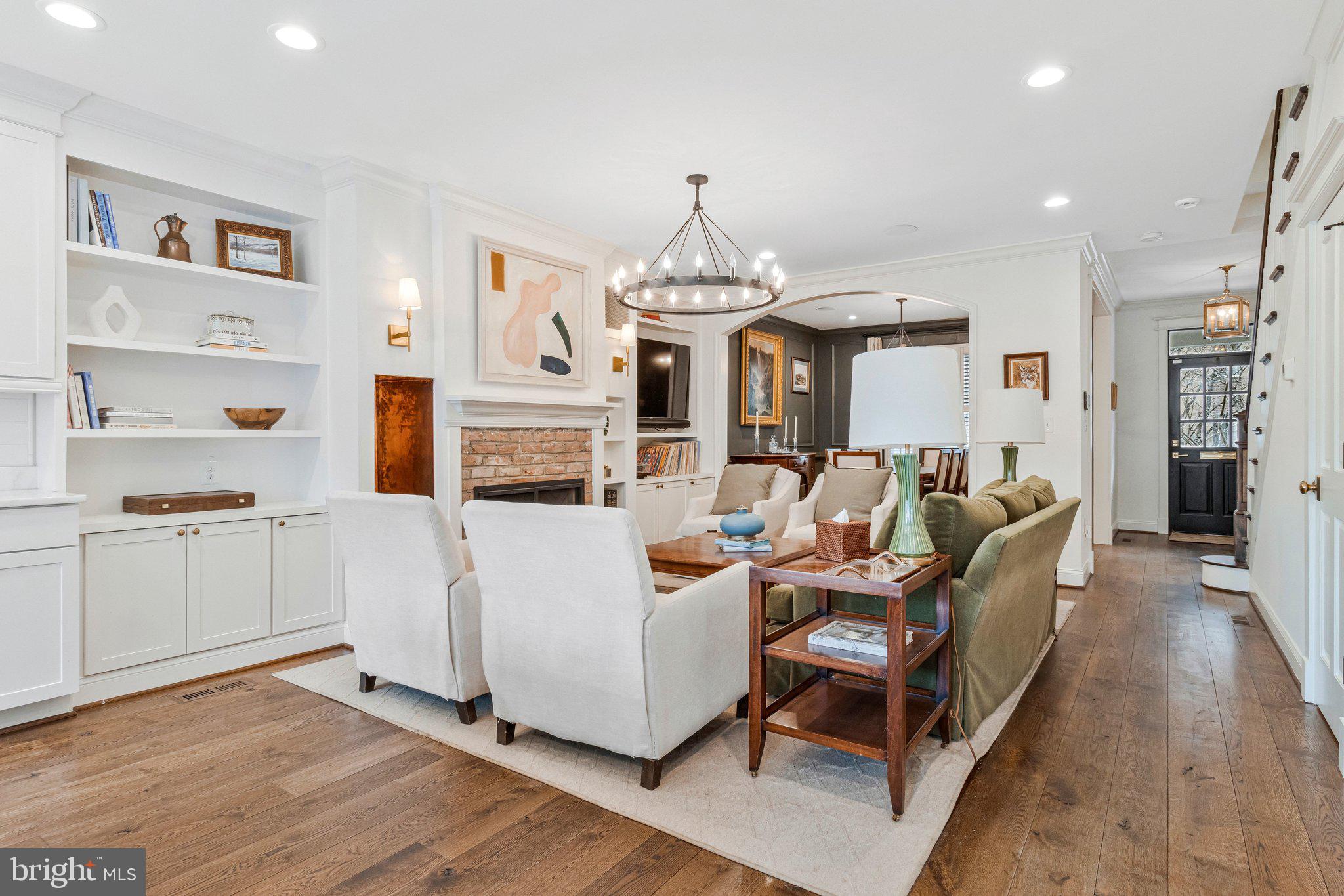 2916 18th Street Northwest Washington, DC 20009 - Photo 7 of 49 a living room with fireplace furniture and a chandelier
