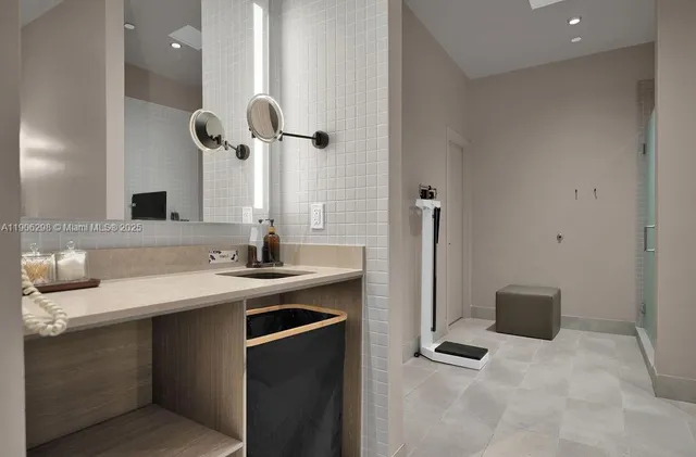 a kitchen with a sink and a refrigerator