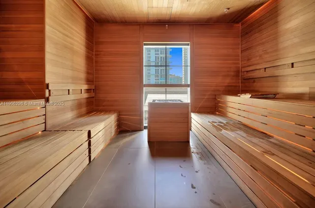a bathroom with a bathtub and shower