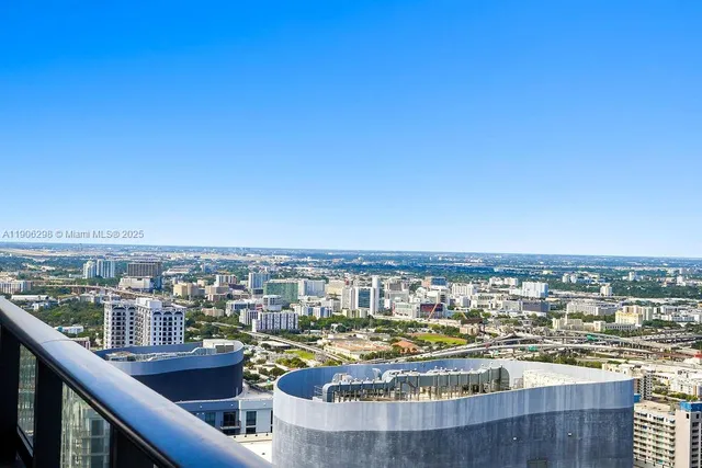 a view of a swimming pool with outdoor seating