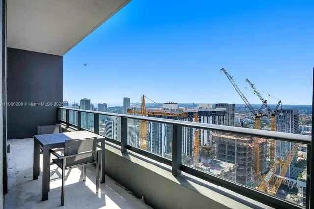 a view of a balcony with furniture
