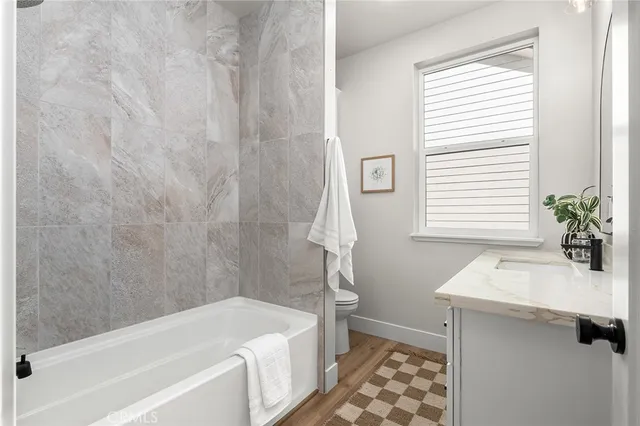 a bathroom with a sink a bathtub and a shower
