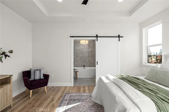 a bedroom with a bed and a table