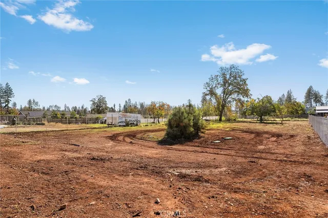 a view of a house with a yard and covered with snow