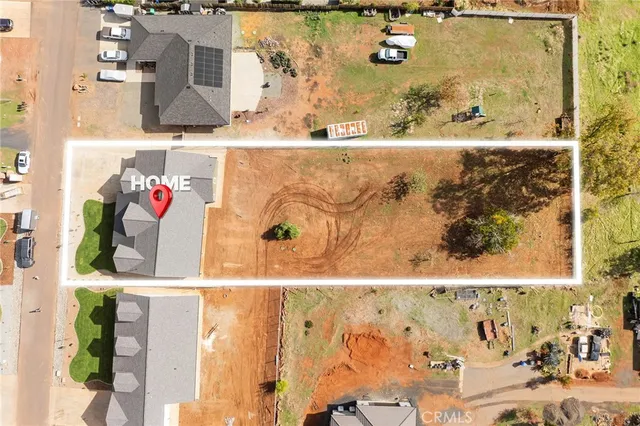 an aerial view of residential houses with city view