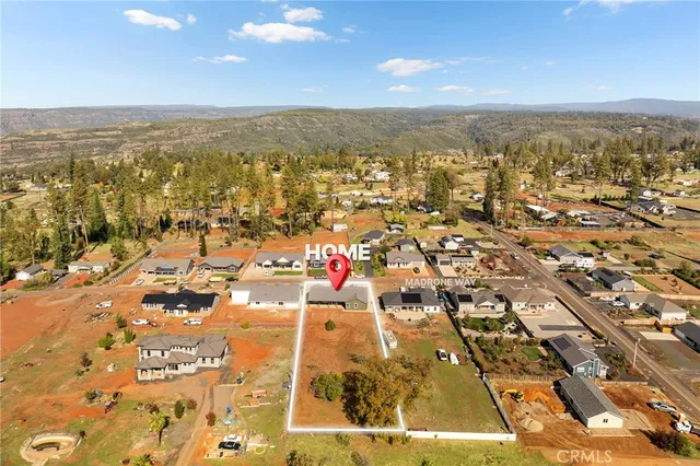 an aerial view of residential building and ocean view