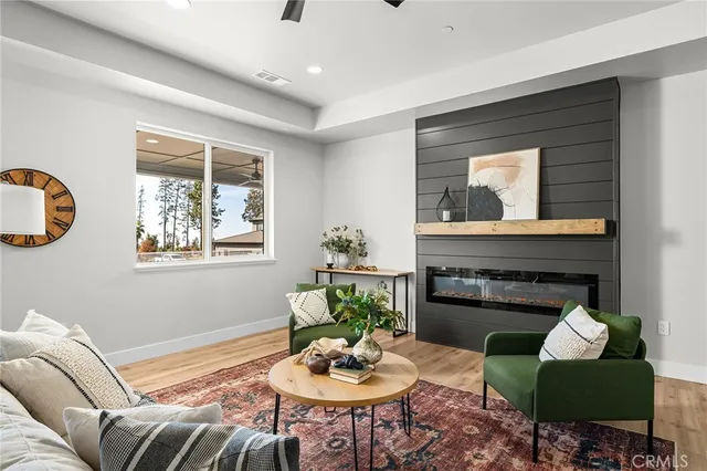 a living room with furniture and a fireplace