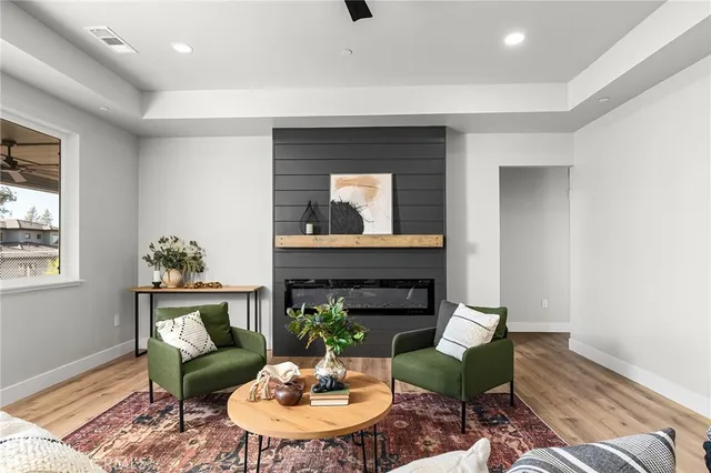 a living room with furniture and a fireplace