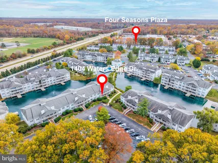 an aerial view of a house with a swimming pool yard and outdoor seating