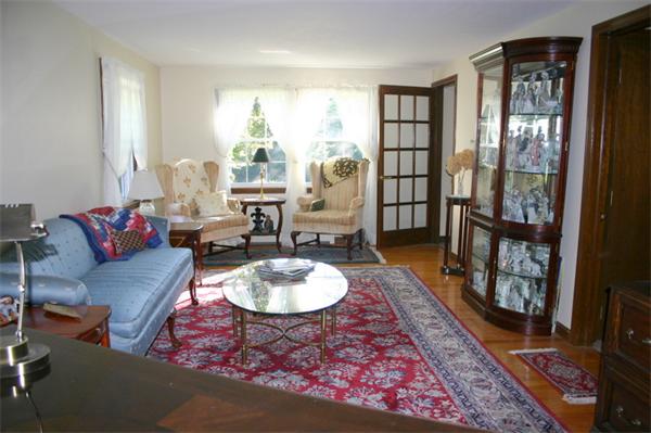 104 Laurel Road Wilbraham, MA 01095 - Photo 11 of 29 a living room with furniture and a wooden floor