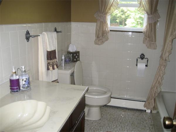 104 Laurel Road Wilbraham, MA 01095 - Photo 12 of 29 a bathroom with a sink a toilet and shower