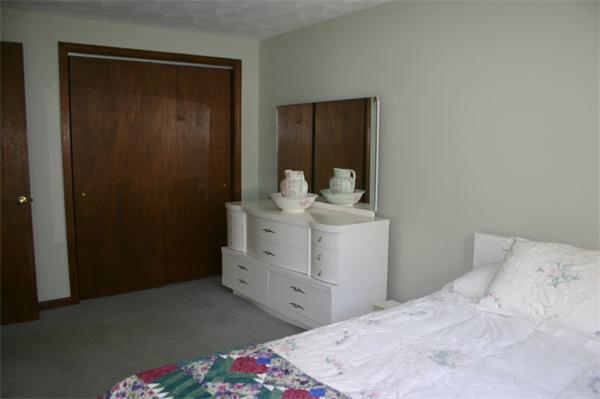 104 Laurel Road Wilbraham, MA 01095 - Photo 14 of 29 a bedroom with a bed and a dresser
