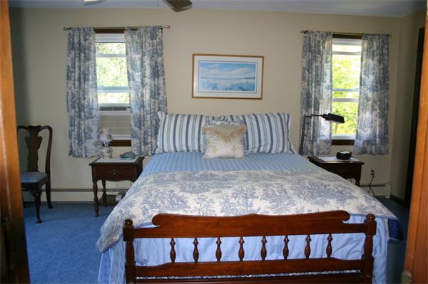 104 Laurel Road Wilbraham, MA 01095 - Photo 17 of 29 a bed sitting in a bedroom next to a window