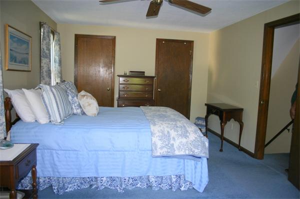 104 Laurel Road Wilbraham, MA 01095 - Photo 18 of 29 a bedroom with a bed and a flat tv screen on dresser