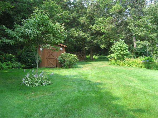 104 Laurel Road Wilbraham, MA 01095 - Photo 23 of 29 a backyard of a house with trees and outdoor space