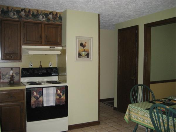 104 Laurel Road Wilbraham, MA 01095 - Photo 6 of 29 a kitchen with a stove and a refrigerator