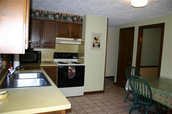 104 Laurel Road Wilbraham, MA 01095 - Photo 7 of 29 a kitchen with a stove and a refrigerator