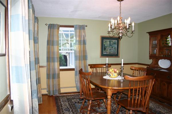 104 Laurel Road Wilbraham, MA 01095 - Photo 8 of 29 a view of a dining room with furniture a chandelier and wooden floor