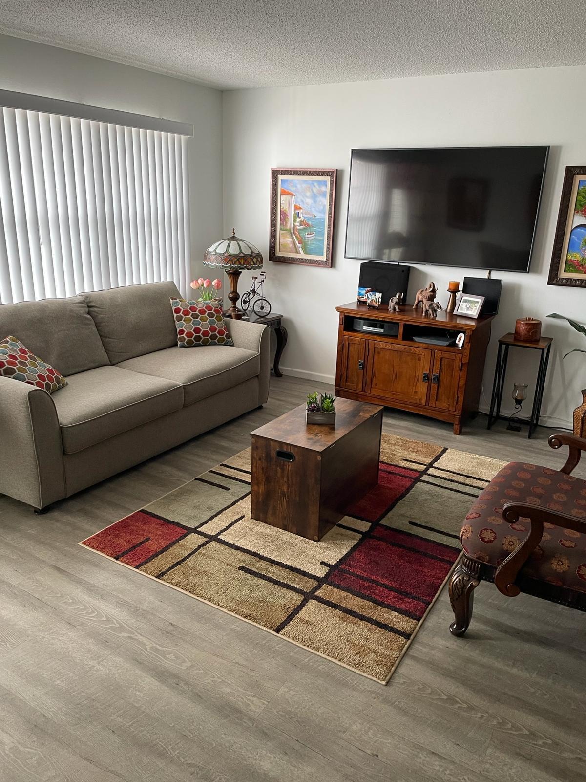 2052 Cornwall C, Unit 2052 Boca Raton, FL 33434 - Photo 1 of 34 a living room with furniture and a flat screen tv