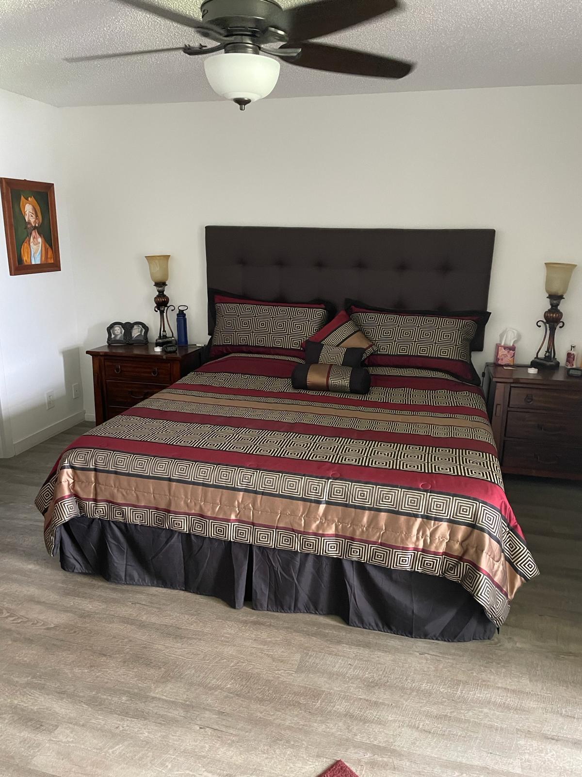 2052 Cornwall C, Unit 2052 Boca Raton, FL 33434 - Photo 14 of 34 a bedroom with a bed and a night stand