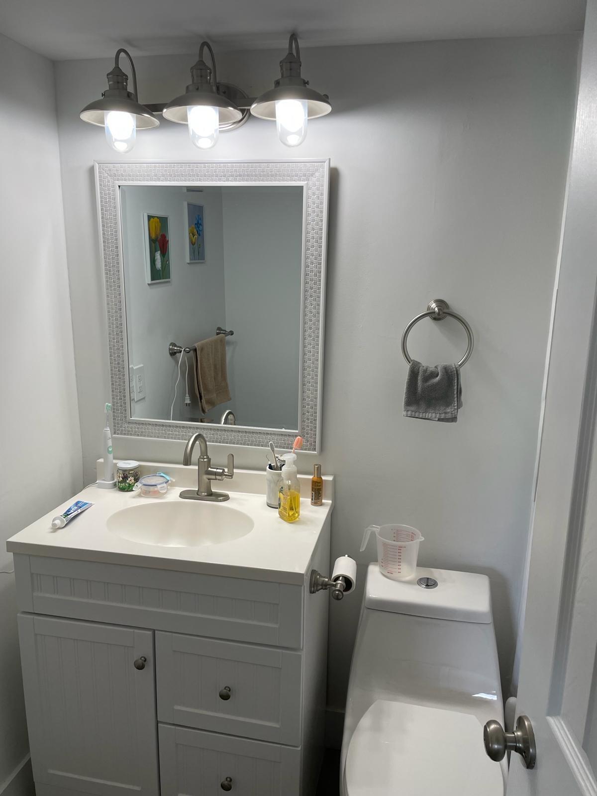 2052 Cornwall C, Unit 2052 Boca Raton, FL 33434 - Photo 16 of 34 a bathroom with a sink and a mirror