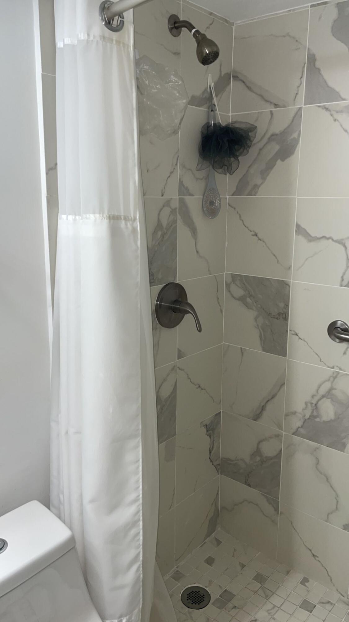 2052 Cornwall C, Unit 2052 Boca Raton, FL 33434 - Photo 21 of 34 a bathroom with a shower