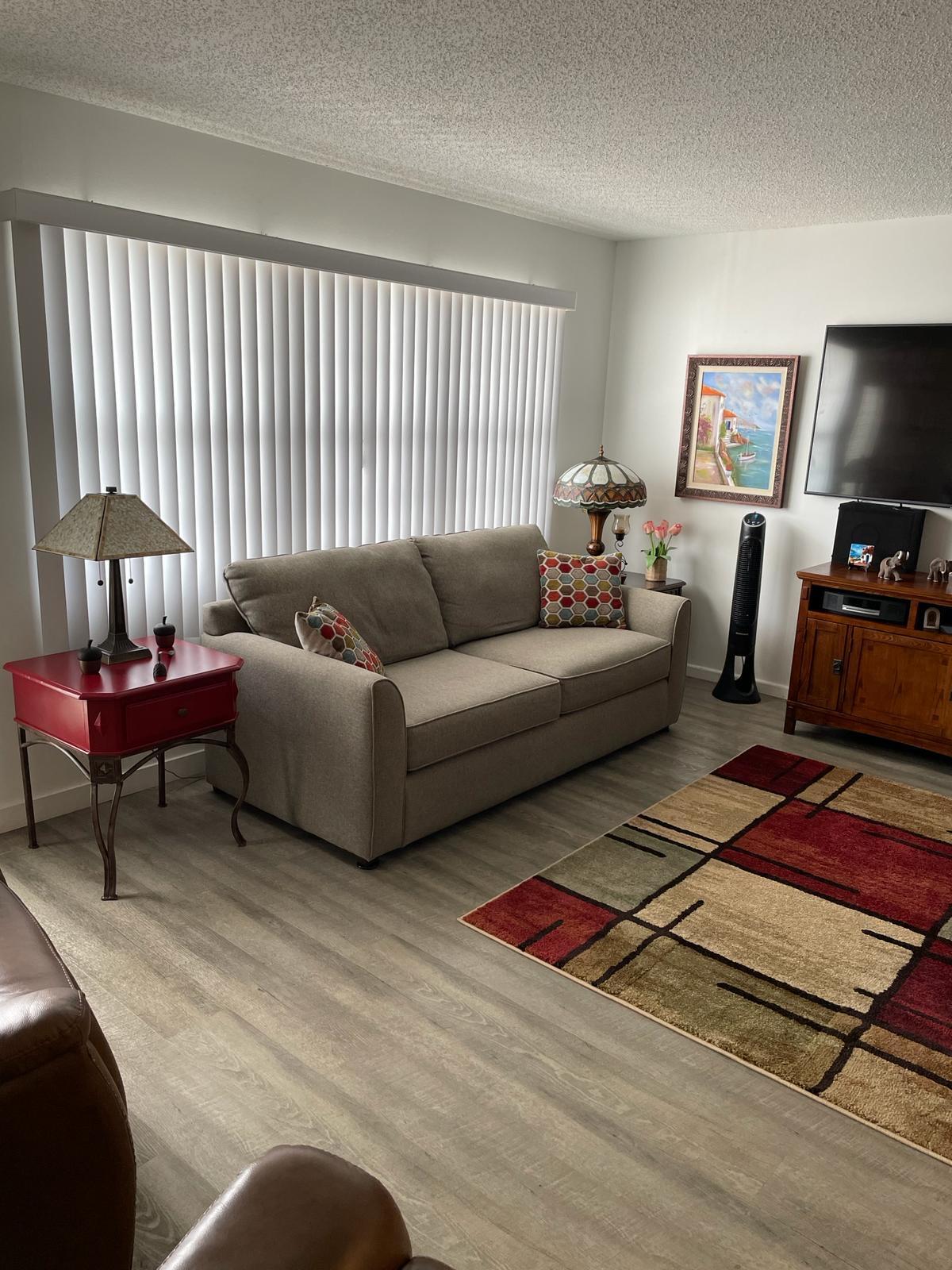 2052 Cornwall C, Unit 2052 Boca Raton, FL 33434 - Photo 6 of 34 a living room with furniture and a lamp