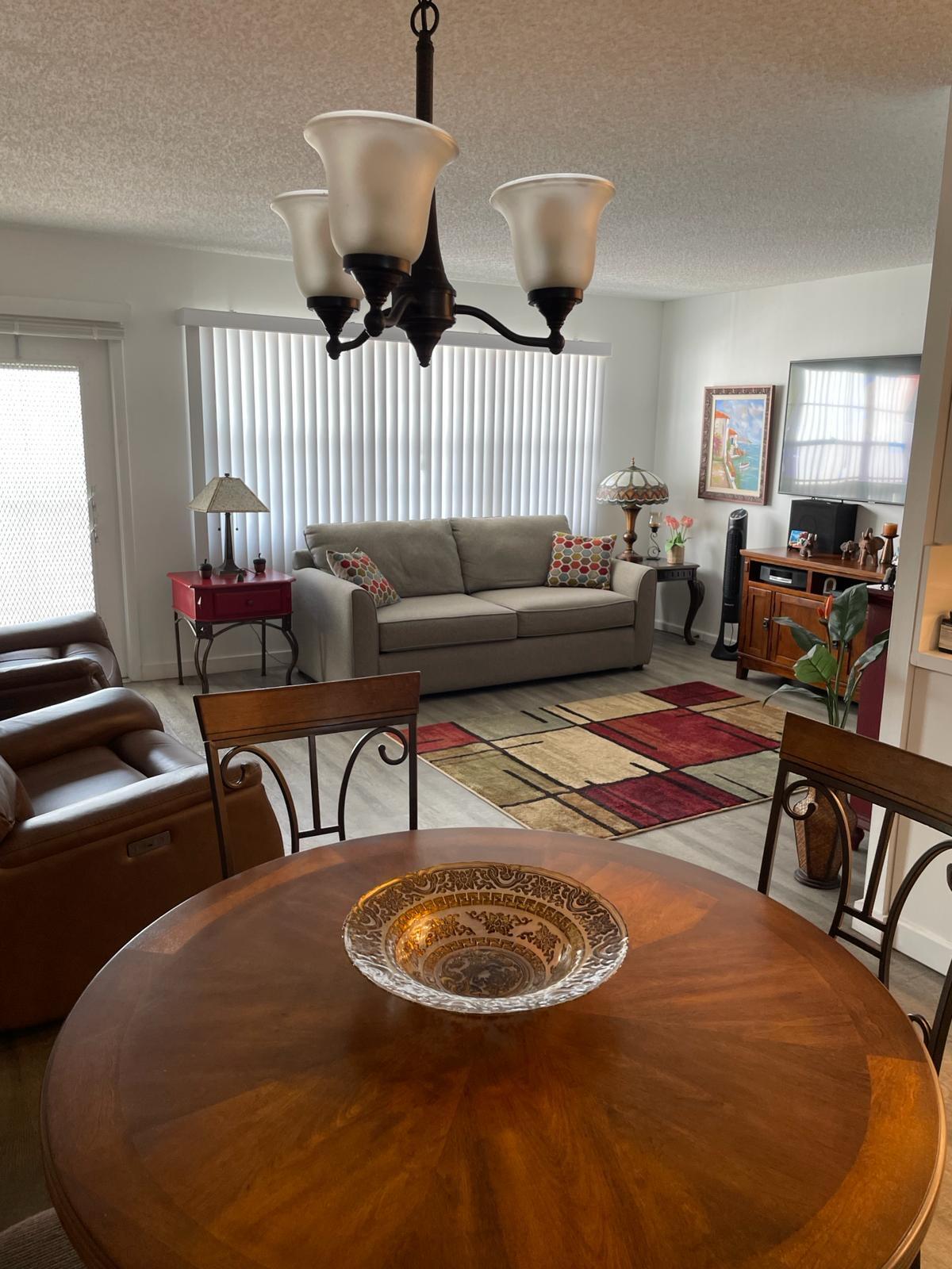 2052 Cornwall C, Unit 2052 Boca Raton, FL 33434 - Photo 8 of 34 a living room with furniture and wooden floor