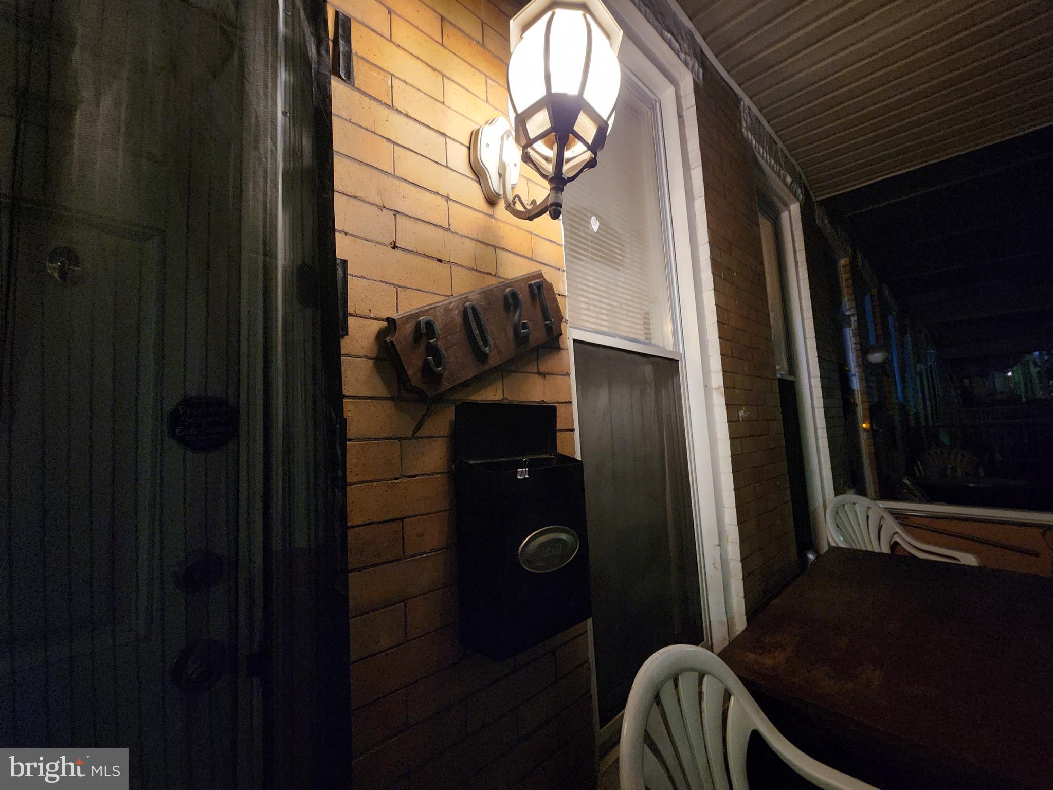 3027 Walbrook Avenue Baltimore, MD 21216 - Photo 4 of 20 a room with a mirror